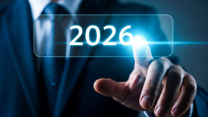 Business professional interacting with futuristic digital interface displaying the year