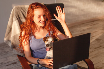Young woman having video call on laptop
