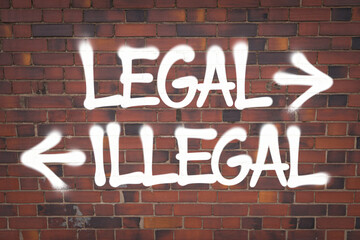 Obraz premium Legal vs Illegal Graffiti on Brick Wall with White Spray Paint in Contrasting Arrows for Law and Order Theme