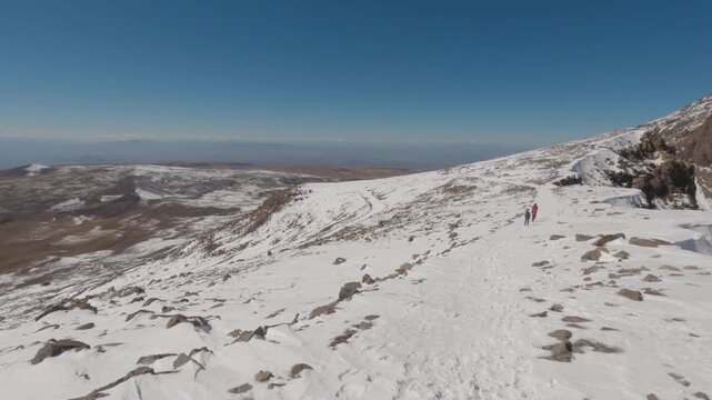 Tourists on the way from the crater of Mount Aragats, South summit in Armenia.