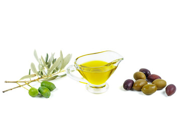 Delicious olive oil, black and green olives with leaves isolated on a white background