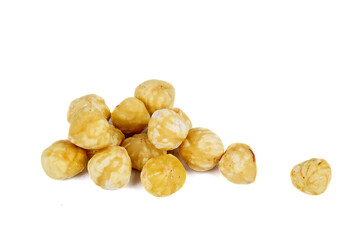 Few roasted and peeled hazelnuts isolated on a white background