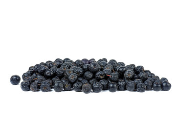 Pile of chokeberries isolated on white background
