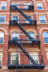 A classic red brick apartment building facade in New York City.