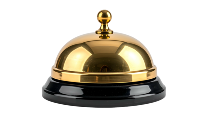 Shiny gold-colored bell with a black base, isolated against a solid black background
