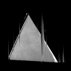 An abstract art triangle design with glitch effect in black and white monochrome