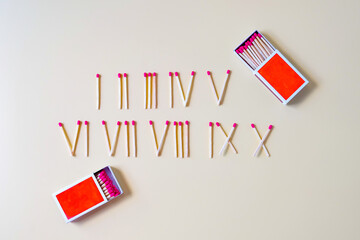 Pile of Wooden unused match stick in Roman numerals.