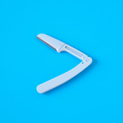 Razor for shaving on color background.