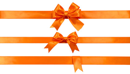 Vivid orange satin ribbons, two bows, against a black background