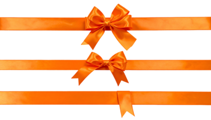 Vivid orange satin ribbons, two bows, against a black background