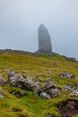 Old Man of Storr rising from misty hillside Isle of Skye Scotland