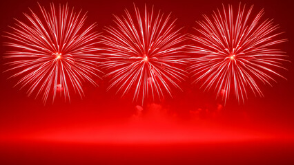 Vibrant red fireworks exploding in the night sky