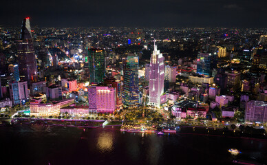 Fototapeta premium Awesome Ho Chi Minh City skyline. Night view of skyscrapers and other high-rise buildings at downtown of Ho Chi Minh City, Vietnam
