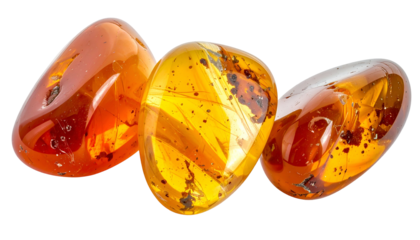 Three translucent, polished amber gems with inclusions, set against a black backdrop