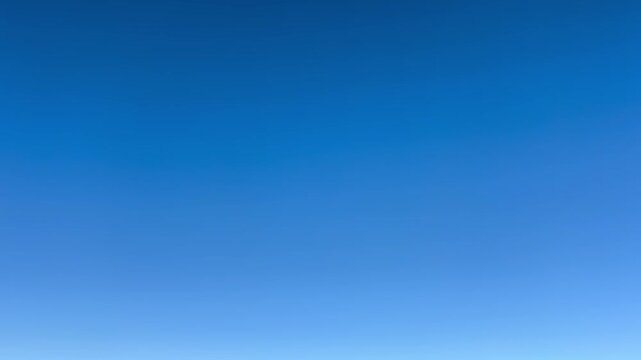 Early morning sky video showing a deep blue gradient before sunrise, clear atmosphere during blue hour, minimal natural background for titles, forecasts, overlays, and copy space usage.