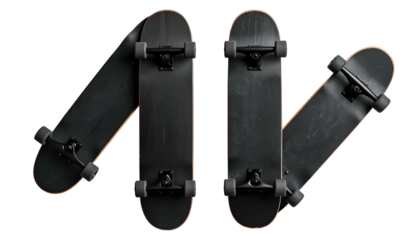 Four angled, matte black skateboards arranged in a wavy, horizontal pattern