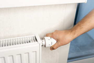 Hand adjusting radiator valve for heating control in winter  