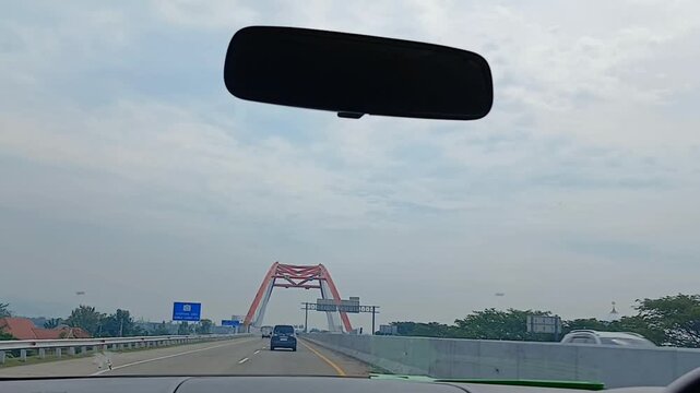 Kali Kuto Bridge, a bridge on the Semarang&ndash;Batang Toll Road (Trans Java Toll Road). A very beautiful red bridge. Recorded in a car. Semarang-Batang road, 