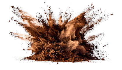 A dynamic burst of brown powder expands outwards against a stark black backdrop