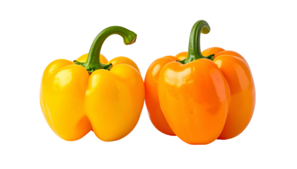 Two vibrant bell peppers, yellow and orange, with green stems, isolated on black