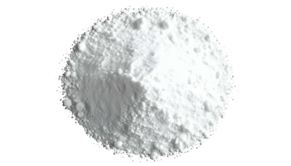 Overhead view of a circular, bright white powder pile against a stark black background