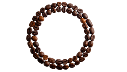 A circular shape crafted from roasted coffee beans, isolated against a black background