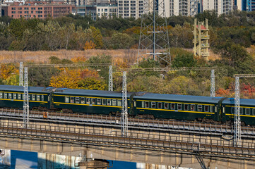 The green train running on the railway in China