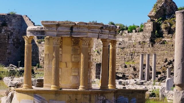 SIDE, TURKEY, June 16, 2024: Ruins of the ancient city of Side in Antalya province on the Mediterranean coast. Amazing ruins of an ancient city. Old statues in the State Agora.The ancient city wall.4K
