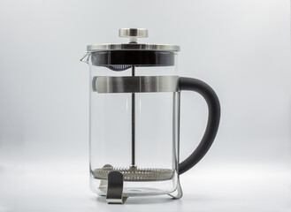 French press tea coffee maker with stainless steel frame closeup.