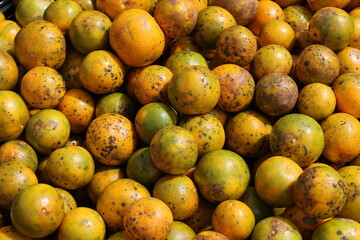 Fresh ripe mango and papaya fruits display vibrant orange and yellow colors at an organic food market, offering a healthy and juicy vegetarian diet choice straight from nature and agriculture