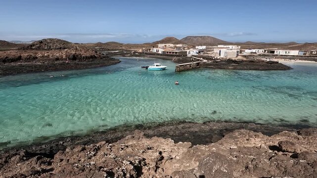 Aerial view of El Puertito rocky beach in the south coast of Lobos Island, on the Atlantic Island of Fuerteventura, Spain.