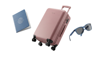 Elegant pastel pink carry-on suitcase with travel accessories isolated on black background