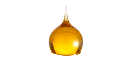 A solitary droplet of golden honey hangs suspended against a stark black background showcasing its viscous texture and radiant glow