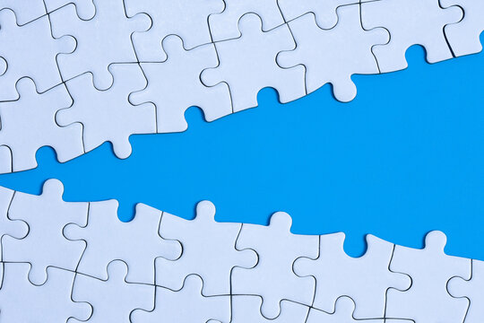 concept of connection or gap with split jigsaw puzzle 