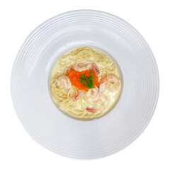 Spaghetti with ebiko in rich cream sauce and shrimp, served on a white plate, isolated on a transparent background.