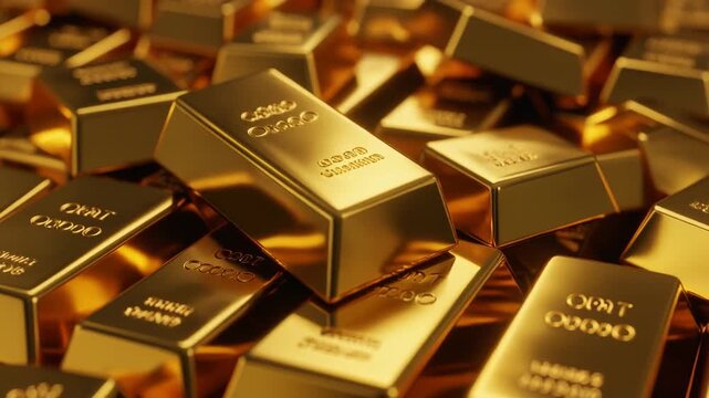 Stacked gold bars on a white table representing wealth and investment