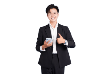 Confident Professional with Smart Device: A sharply dressed professional exudes confidence as he holds a smartphone, giving a thumbs-up gesture, symbolizing approval and success.