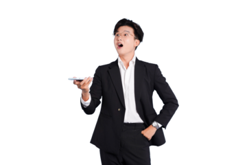 Surprised Businessman with Device: A modern businessman in a formal suit stands out with an amazed expression, holding a tablet, as if observing a surprising digital world. 