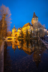Fototapeta premium Beautiful Vajdahunyad castle in Budapest, Hungary. Blue hours scenery with amazing reflection.