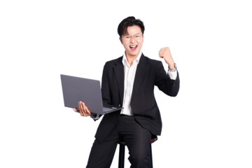Success and Innovation: A focused business person sits holding a laptop, arm raised in a gesture of success and excitement. The image captures the modern essence of business.
