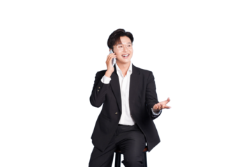 Modern Communicator: A professional in a sharp suit sits, engaged in a vibrant phone conversation, possibly closing a deal or delivering good news.