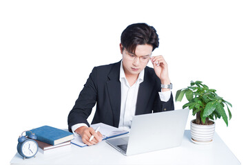 Focused Professional at Desk: A concentrated professional, immersed in work at his desk, meticulously reviews notes and a laptop, with a pen in hand, suggesting dedicated focus and diligent analysis.