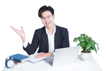 Confident Professional at Desk: A smiling, confident professional sits at a desk, laptop open, presenting an open hand, exuding an air of expertise and approachability. A well-lit workspace setting.