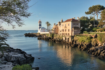 Obraz premium Santa Marta Beach in Cascais, Portugal. The Santa Marta lighthouse and lighthouse museum. Also pictured is the Santa Maria House Museum.