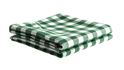 Stacked, green and white checkered cloth napkins on a black background
