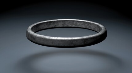A silver ring with a textured surface.