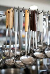 Stainless Steel Kitchen Ladles with Wooden Handles on Retail Display