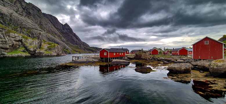 Old Fishermen Village Nusfjord With Rorbuer Huts And Calm Fjord On Lofoten Islands In Norway