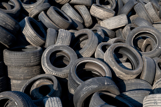Chaotic Pile Of Discarded Car Tires Waiting For Reuse Or Recycling