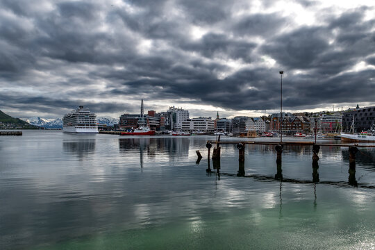 Tromso Harbor With Cruise Ship And Modern Buildings In Calm Fjord In Norway